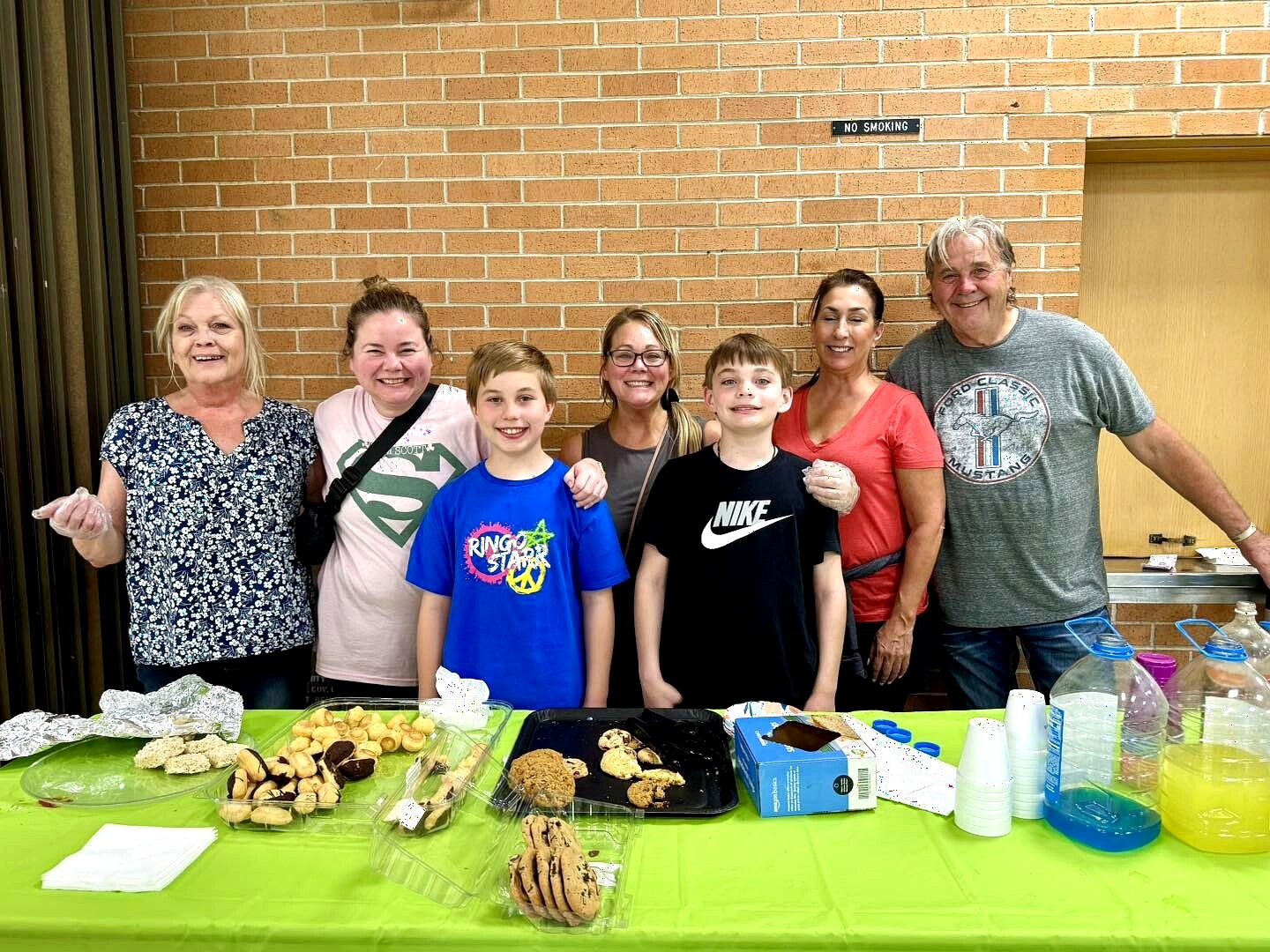 Almost Home Chicago volunteers and families gathered around a community table